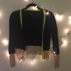 Green, tan, and navy cardigan.