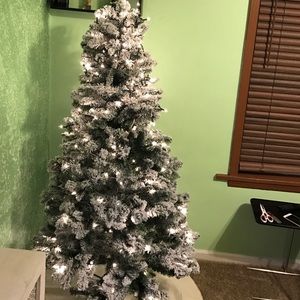Pre lit snow Christmas tree. Only used one year.