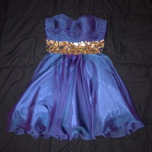 Blue strapless Alyce homecoming/prom dress.
