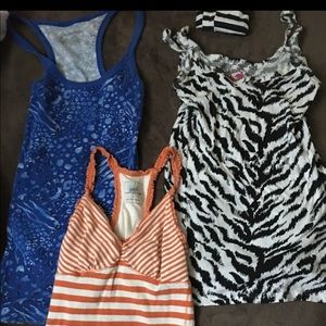 Blue tank top and the zebra style one. NEVER WORN!