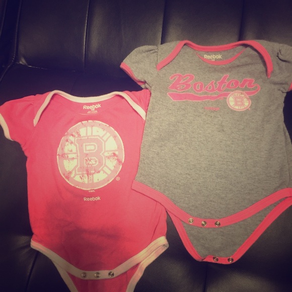 Baby girls Boston bruins onesies.