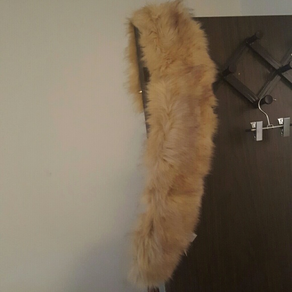 Faux fur lapel. 37 inches long