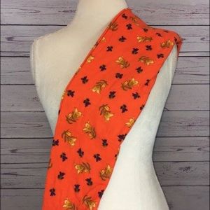 OS orange leggings with gold and purple flowers