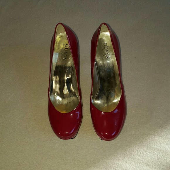Guess red patent leather platform heels.