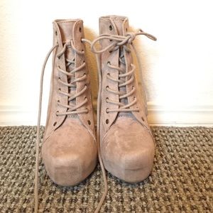 High heeled lace up boots