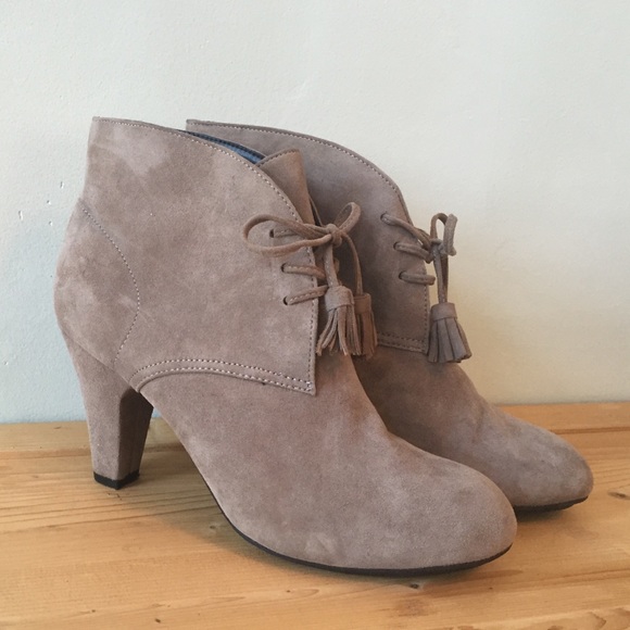 Taupe suede booties with lace up front.