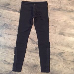 Rare lululemon black tights with ruffle detail.