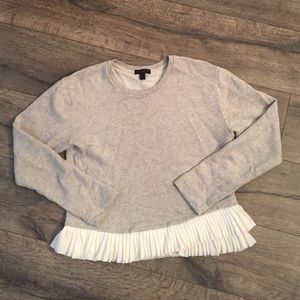 J Crew sweatshirt with ruffle bottom.