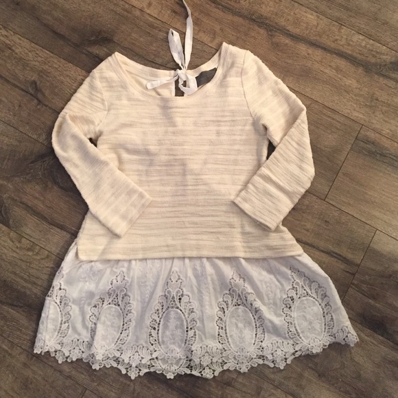 Sweater with lace ruffle bottom.
