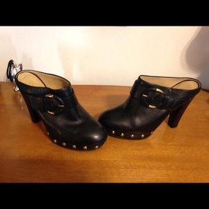 COACH Black leather high heel clogs w/gold buckles
