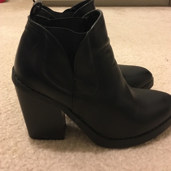 Gently worn black heeled booties.