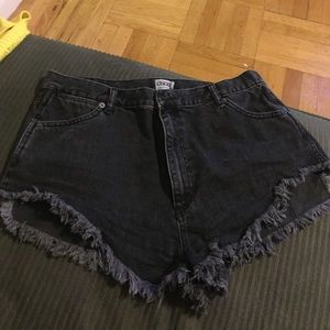 Black Jean shorts with ripped bottom detail
