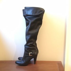 Knee high black leather roll cuff boots