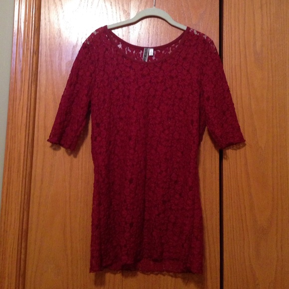 Burgundy colored lacey top.