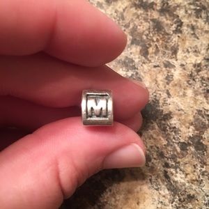 "M" pandora initial charm on hold for buyer