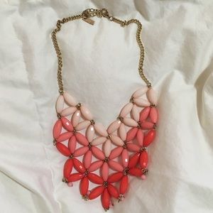 Pale pink to coral ombré bib necklace!