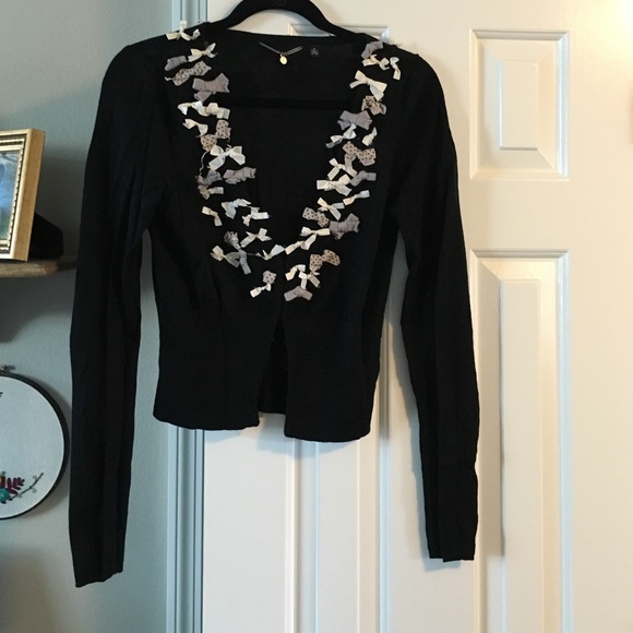 Knitted and knotted bow cardigan sweater