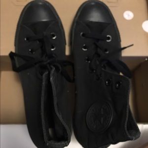 All black Chuck Taylors (Converse)