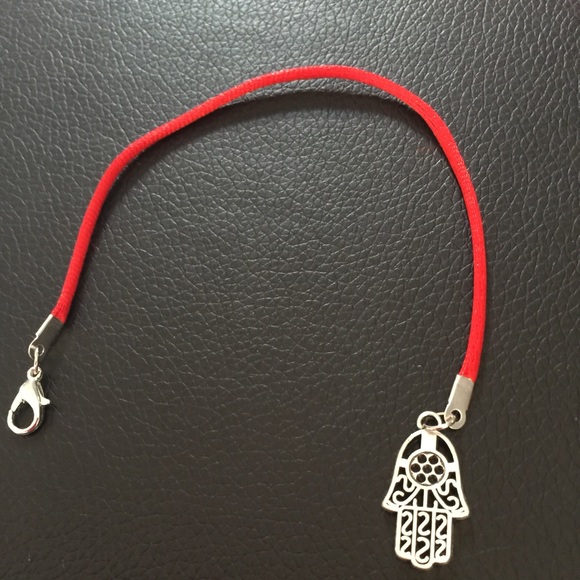 Red string protection bracelet with amulet
