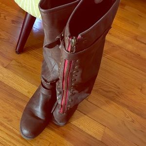 Brown riding boot with red strip