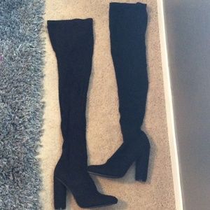 Thigh high black boots