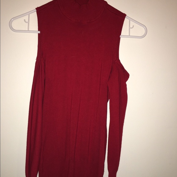 Tight fitting cold shoulder top