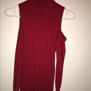 Tight fitting cold shoulder top