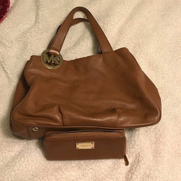 Brown leather Michael Kors purse and wallet