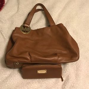 Brown leather Michael Kors purse and wallet