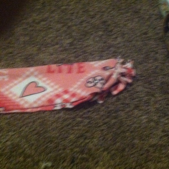 A scarf with all kinds of harts and some sayings.!