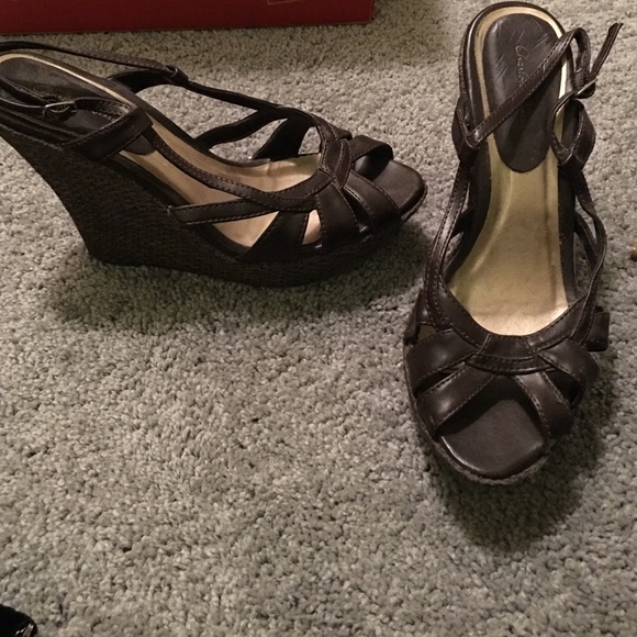 Brown leather wedges.