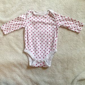 Red polka dotted onesie.