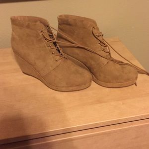 Tan lace up wedged booties