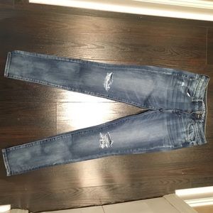 American Eagle faded wash high-rise jeans.