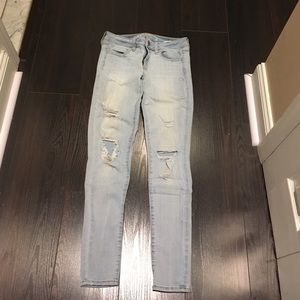 American Eagle light wash destroyed denim jeans
