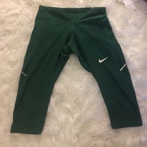 Green Nike exercise pants