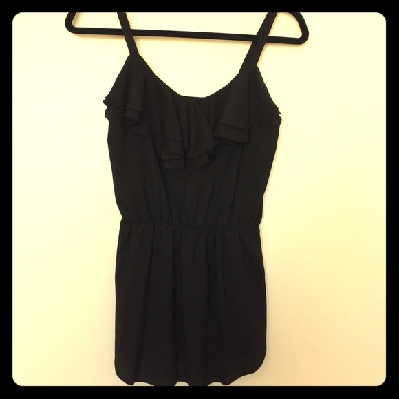 Silky top with cinched waist and ruffled neckline