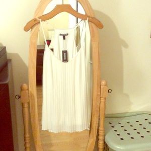 Cream colored express pleated top