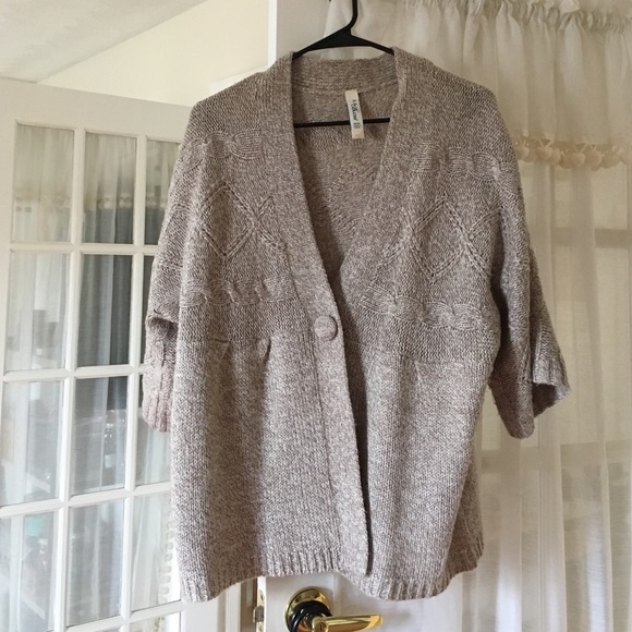 Warm sweater with tan/white threading.