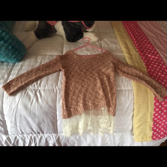 Little girl knitted sweater with lace on bottom