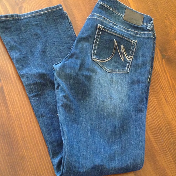 Light distress, boot cut blue jeans