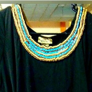 Shirt with beaded neckline