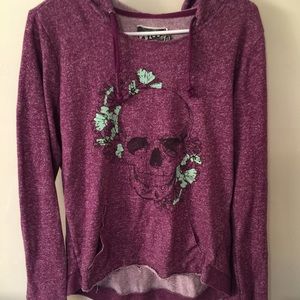 Purple Volcom hoodie with skull design