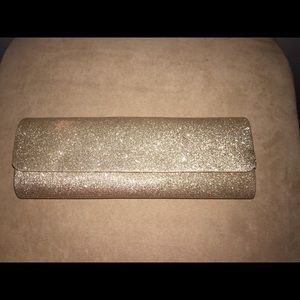 Used tan sparkly clutch