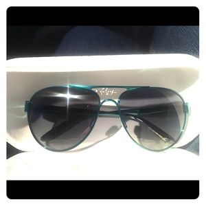 Teal blue polarized Oakley sunglasses.