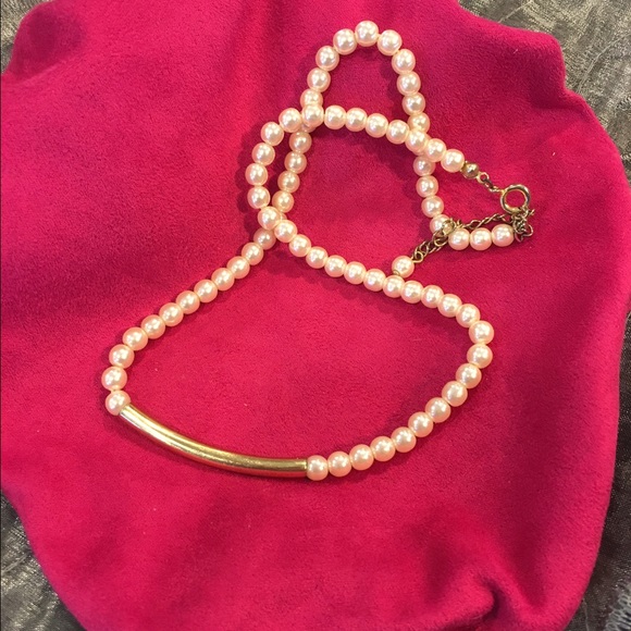 Two costume pearl necklaces one w/gold tone bar