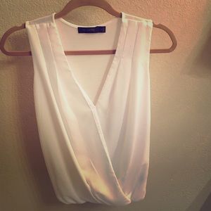 White sleeveless draped blouse
