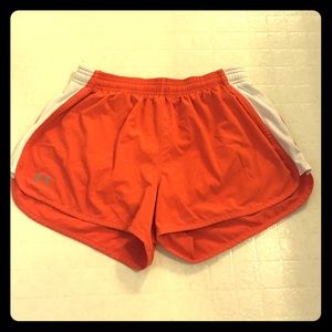 Under Armor running shorts.