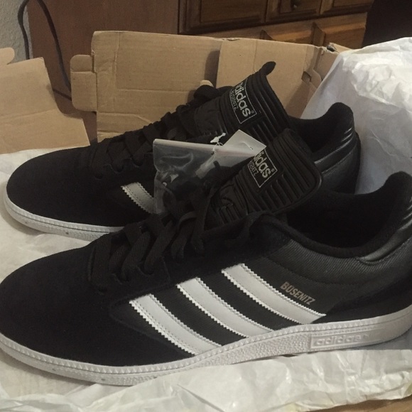 Never worn adidas tags with extra shoe laces