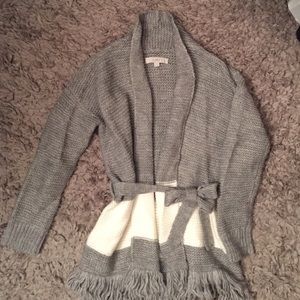 Cozy gray sweater with white stripe.